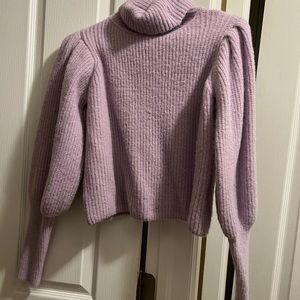 Purple turtleneck sweater with puffed shoulders